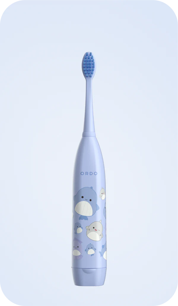 Ordo electric toothbrush in purple with cute cartoon whale and sea creature designs, likely a kids' model.