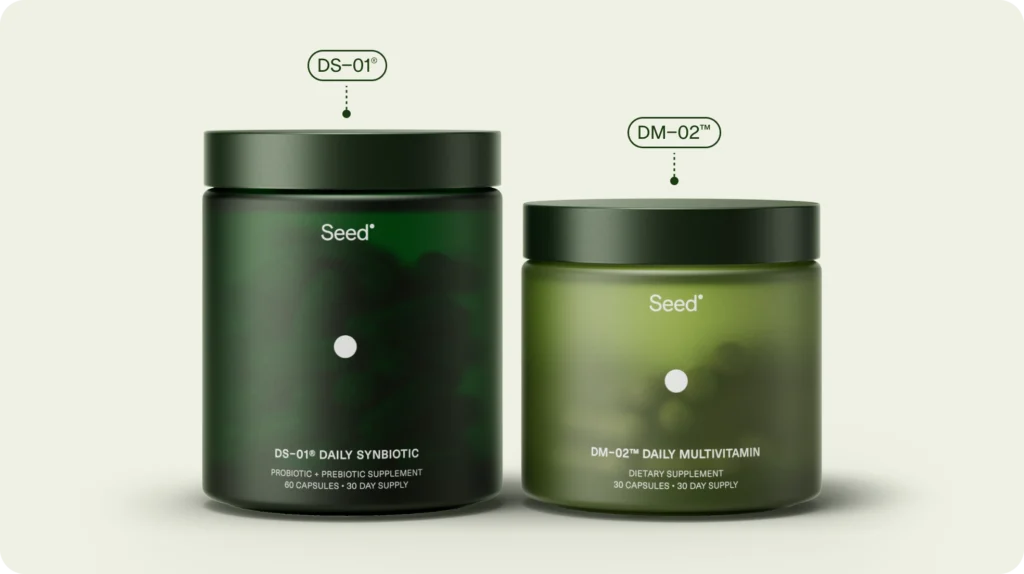 Seed Co-Biotics supplements showing DS-01 Daily Synbiotic and DM-02 Daily Multivitamin in green jars